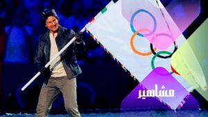 توم كروز يتسلم علم الأولمبياد